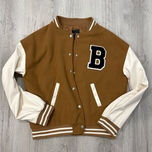 Love Tree’s brown and white varsity jacket